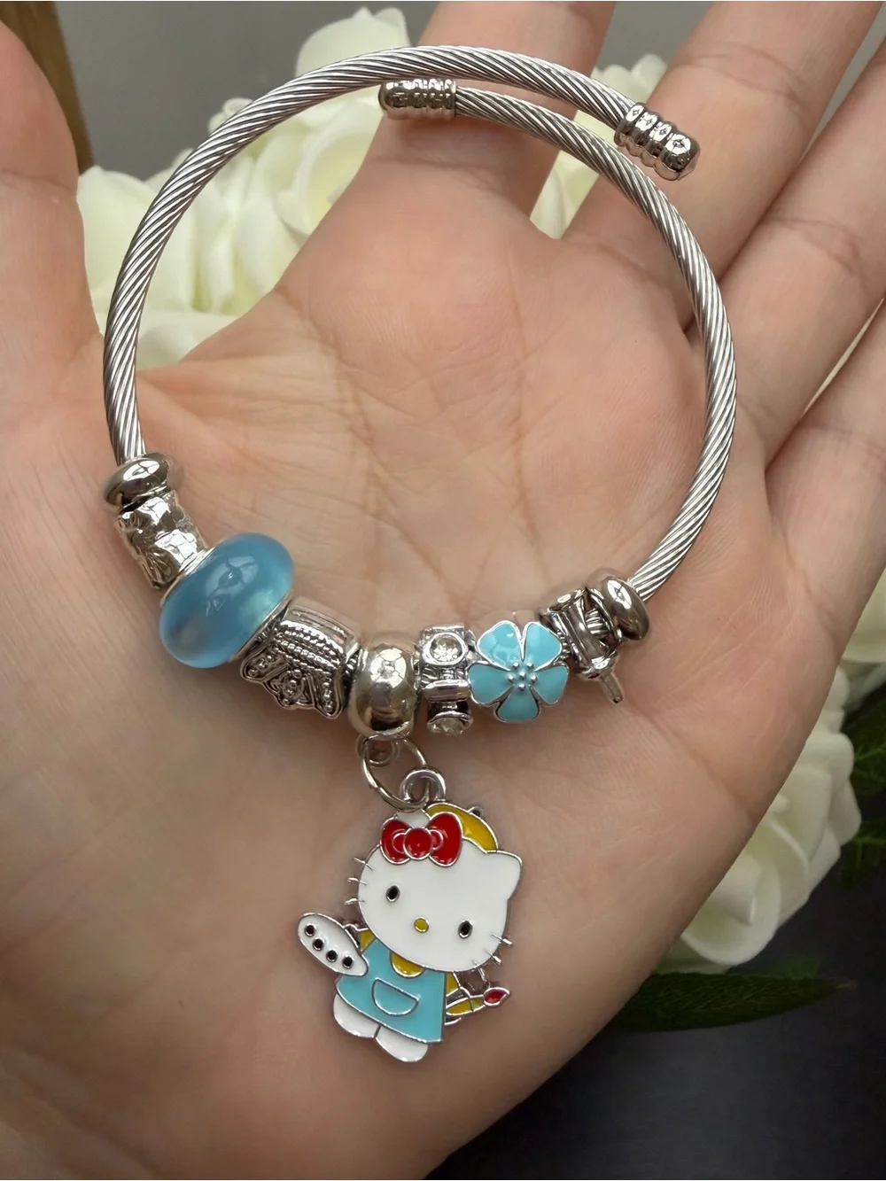 Silver Cable Charm Bangle with Blue Flower Beads and Hello Kitty Charm